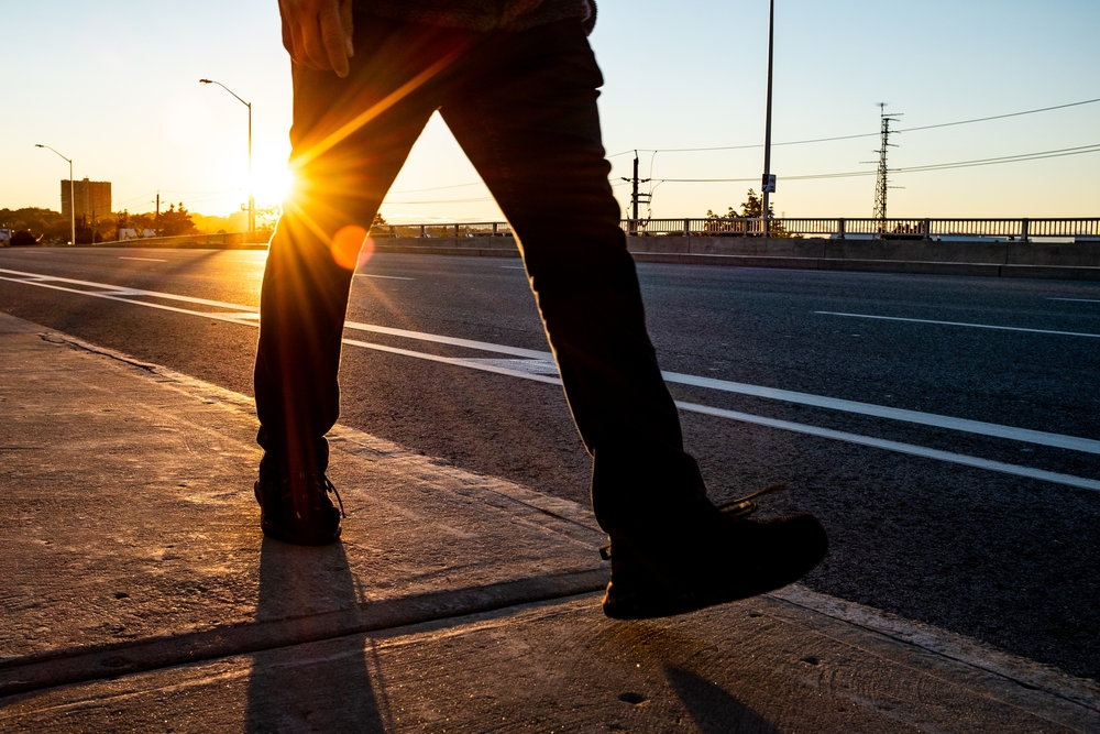 Man walking in sunrise in Toronto
