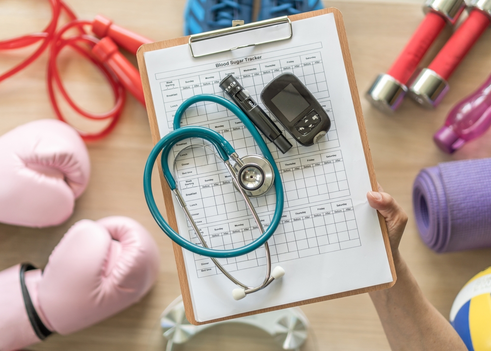 Diabetes monitoring with blood sugar test, glocuse measurement for diabetic disease awareness control for analyzing insulin-deficient illness patient with exercise sport gym equipment background